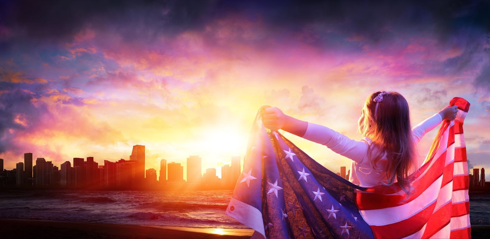 girl holding American flag